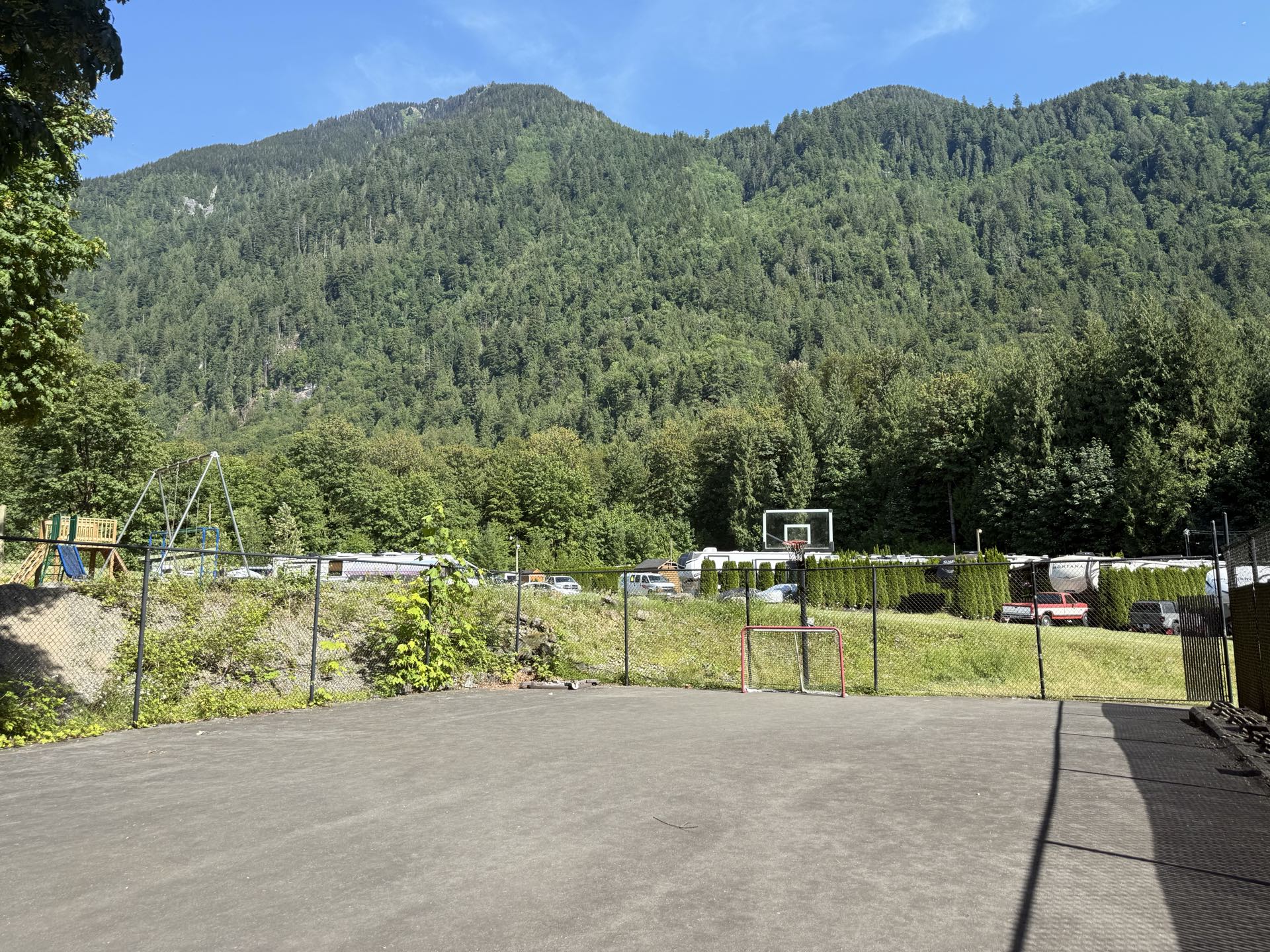 The basketball court, with its cement surface and mountain backdrop