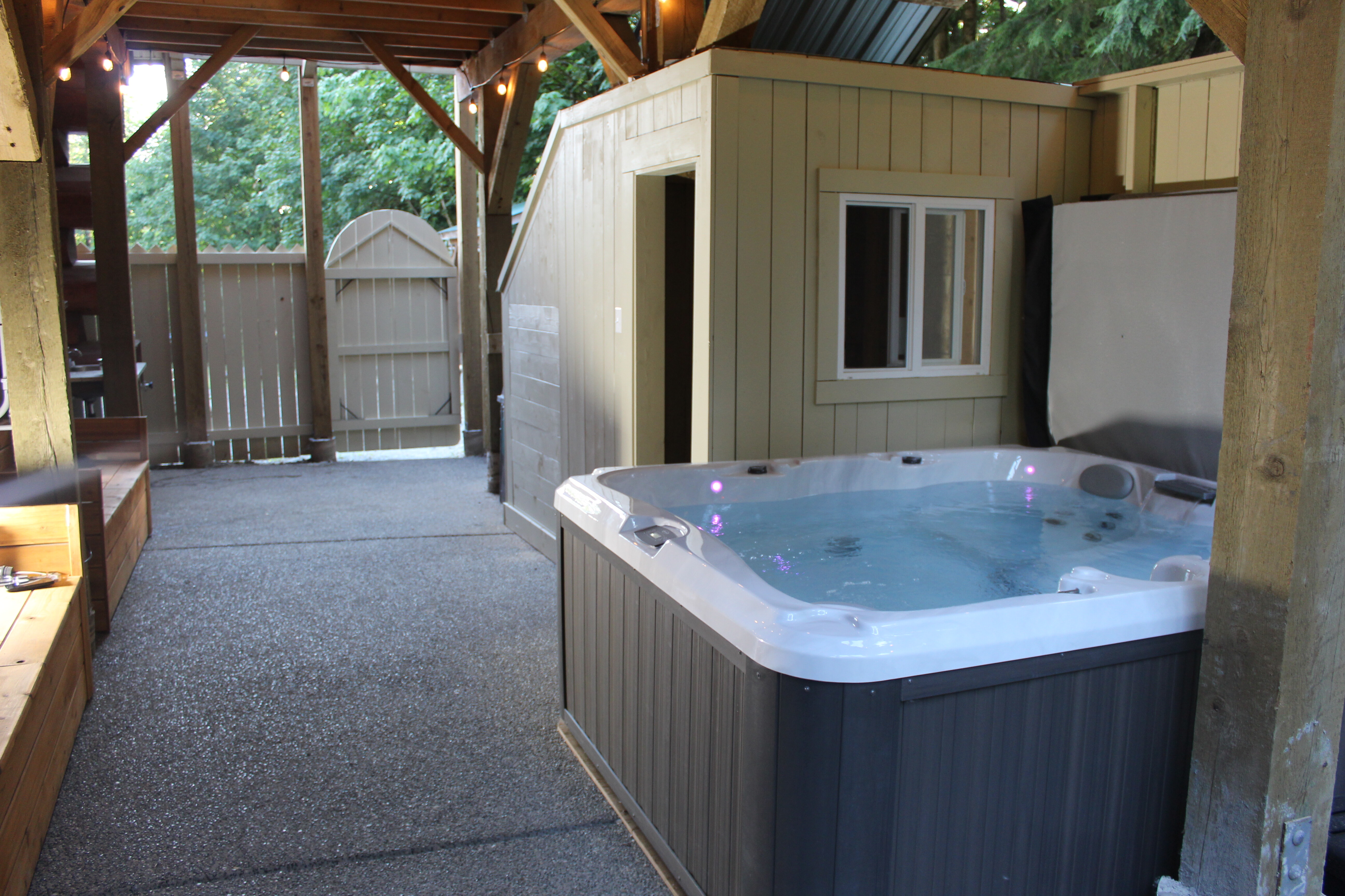 The covered hot tub on the lodge deck, reserved for lodge guests